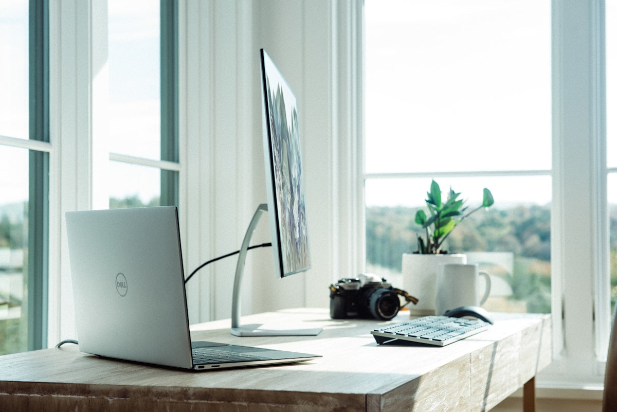 Clean home office desk setup with monitor stand